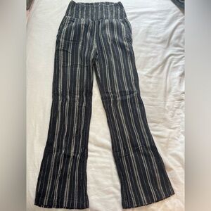 Black white and yellow striped linen blend pants.